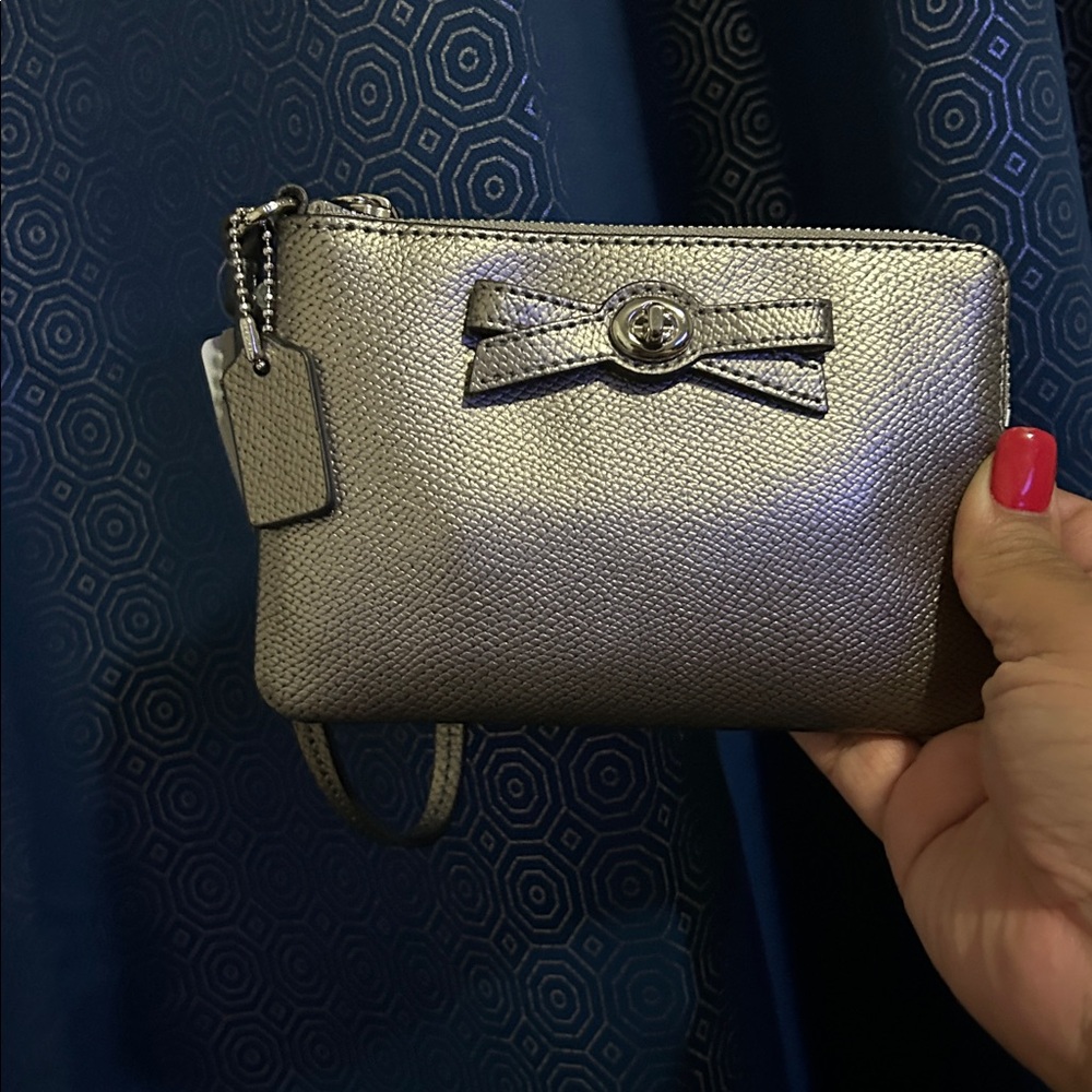 Coach Silver wristlet with bow turnlock nwt